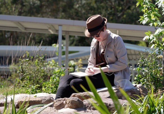 student studying outside